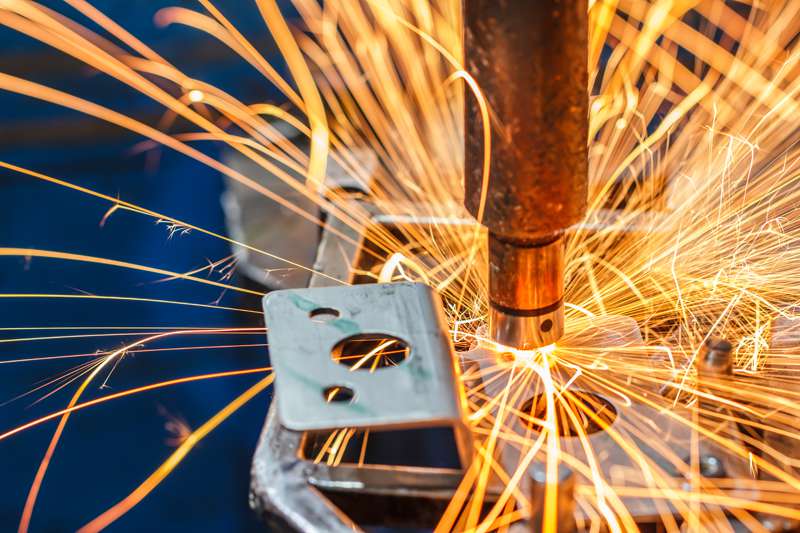 A spot welding machine welds a car part